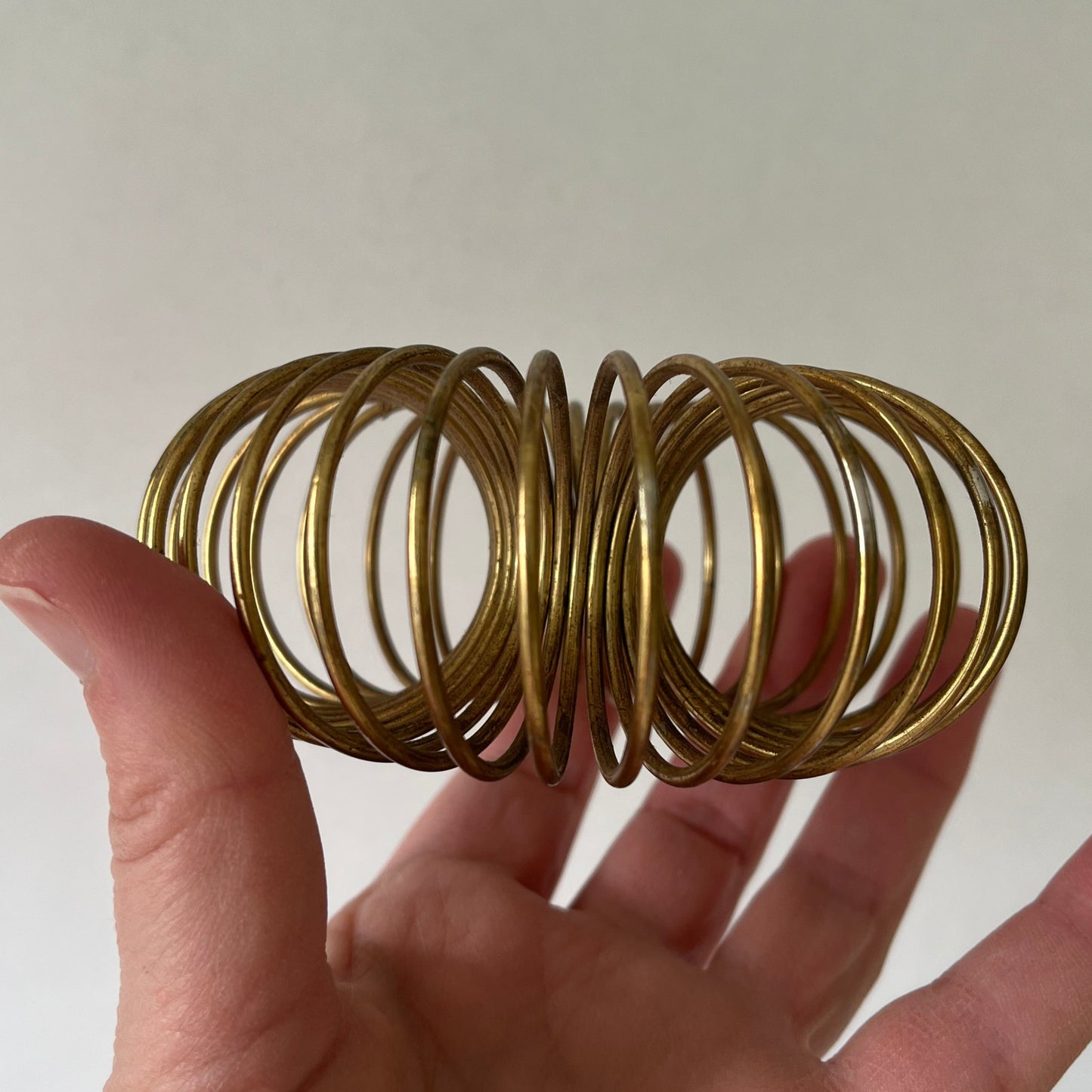 Pair of MCM Brass Unique Coil Expandable Candle Holders